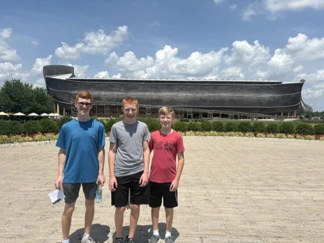 Family gathered before the Ark replica
